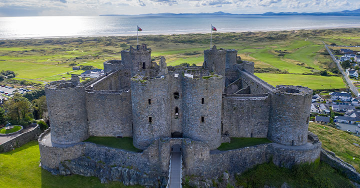 close view of harlech castle with sea in the background