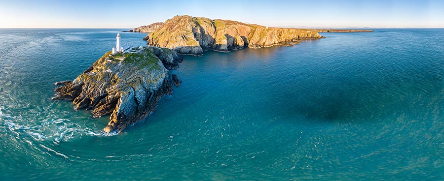 Aerial view of the beautiful cliffs close to the historic South Stack lighthouse on Anglesey - Wales, United Kingdom
