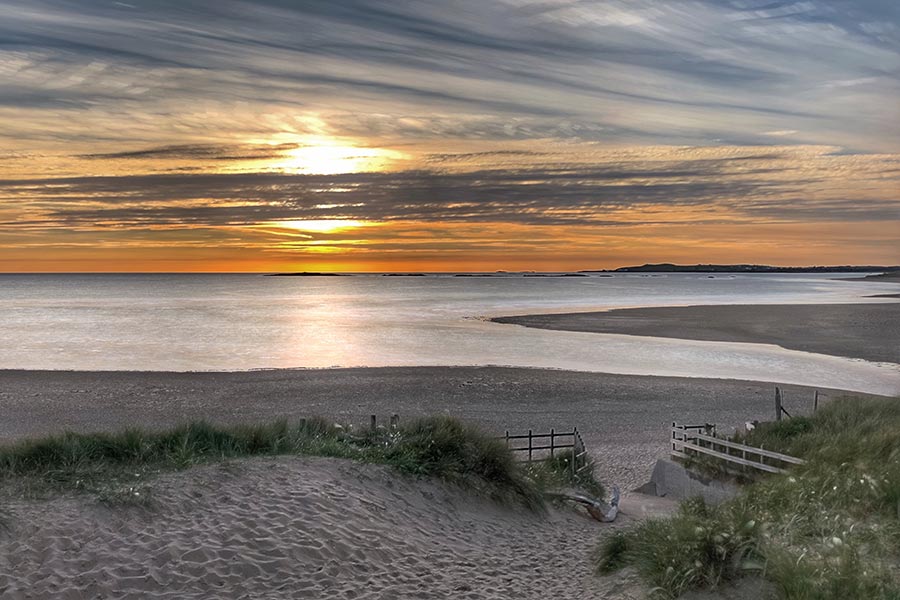 Looking out onto a beautiful Sandy beach at sunset. Taken in Rhosneigr Anglesey.