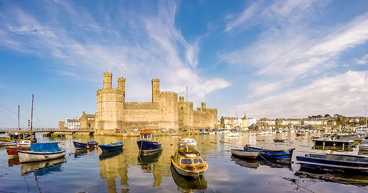 view of caernarfon castle looking over the bay